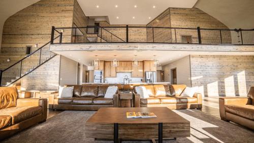 a large living room with couches and a table at East Cabin- Yellowstone Family Retreat- Sled Hill in Ashton