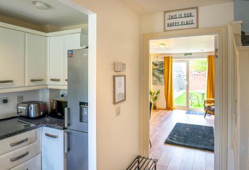 a kitchen with a refrigerator and a dining room at Terry Haven-2Bed,Coventry,Luxury in Parkside
