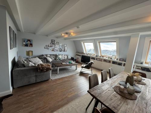 a living room with a couch and a table at City Residence H14 - Prime location - perfect for Business & Lifestyle in Hamburg