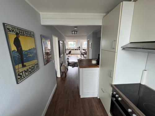 a hallway with a kitchen and a living room at City Residence H14 - Prime location - perfect for Business & Lifestyle in Hamburg