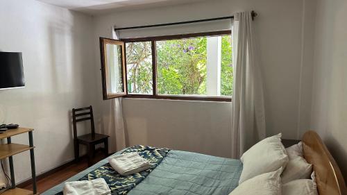 Apartamentos Otorongo Cuenca Ecuadorにあるベッド