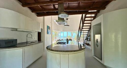 a kitchen with a large island in the middle at Spirit Holbox in Holbox Island