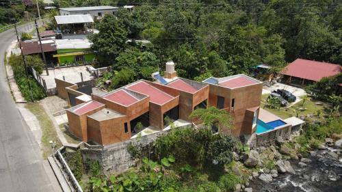 an aerial view of a house with a swimming pool at Casa La Kin in Cacahuatán