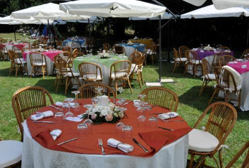 a table set up for a party with tables and chairs at Borgo Patierno in Conca della Campania