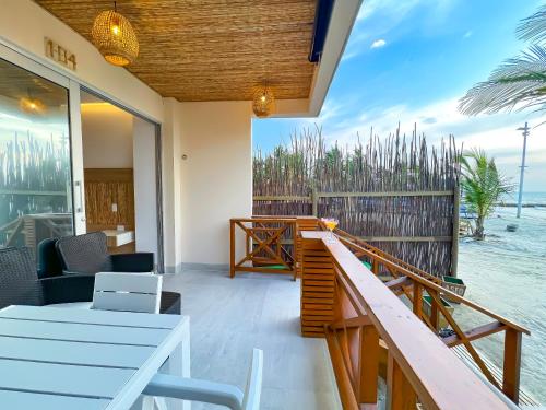 a balcony of a resort with a view of the ocean at Laguna Beach, Brisa Marina playa Frances in Coveñas