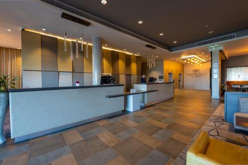 a lobby of a hotel with a reception desk at Crowne Plaza Aberdeen Airport by IHG in Dyce