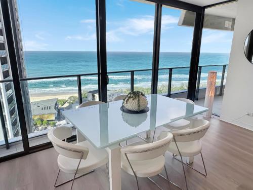 a dining room with a table and chairs and the ocean at Oracle Broadbeach Tower 1 Lvl 20 Free parking - GC Getaways in Gold Coast