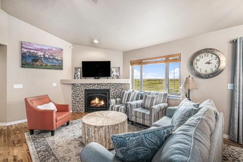 a living room with a couch and a fireplace at Ranch Retreat W Hot Tub & Patio in Cheyenne