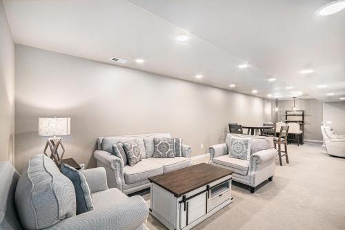 a living room with couches and chairs and a table at Ranch Retreat W Hot Tub & Patio in Cheyenne