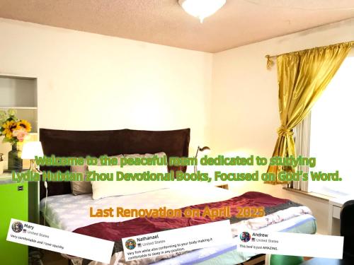 a bedroom with a bed and a window with a banner at Lydia Enoch Sweet Family in Renton