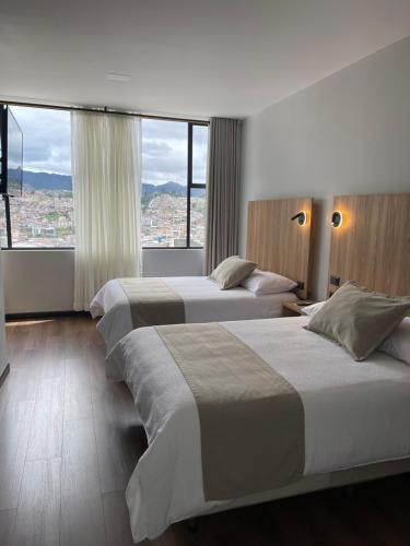 Postel nebo postele na pokoji v ubytování Universitario Hotel