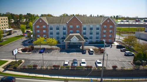 a large building with cars parked in a parking lot at Parkview Inn & Suites, Lancaster Amish Country, PA in Lancaster