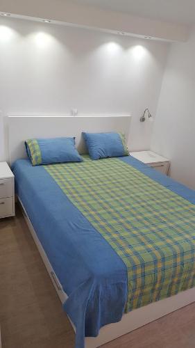 A bed or beds in a room at Apartment MilaS