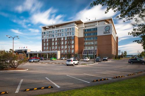 a parking lot in front of a large building at Hotel Blackfoot in Calgary