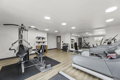 a gym with treadmills and cardio equipment in a room at Candlewood Suites Flowood, MS by IHG in Luckney