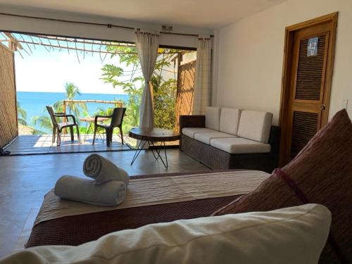 a living room with a view of the ocean at Cocobeach Palomino in Palomino