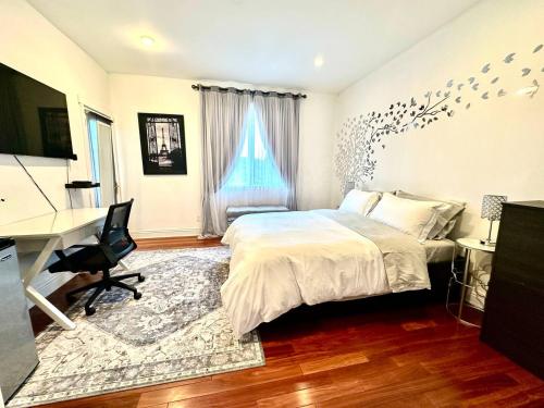 a bedroom with a bed and a desk and a computer at Your Vacation Home in the Hills of Studio City in Studio City