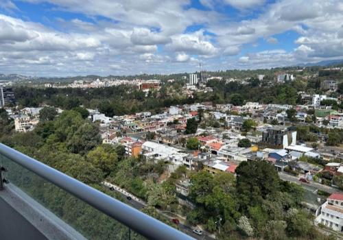 a view of a city from a balcony at Zona 15 in Concepción Las Lomas