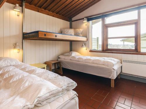 a room with two beds and a window at 6 person holiday home in Gilleleje in Gilleleje