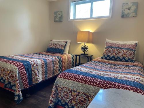 Ένα ή περισσότερα κρεβάτια σε δωμάτιο στο Sunset View