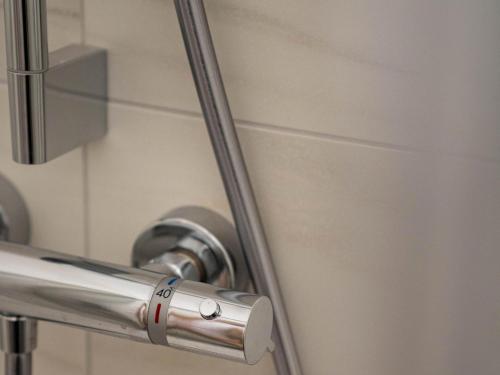 a close up of a metal door handle in a bathroom at Murleben Top 09 in Stadl an der Mur