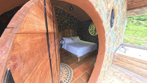 Katil atau katil-katil dalam bilik di Cabaña Magica Estilo Hobbit