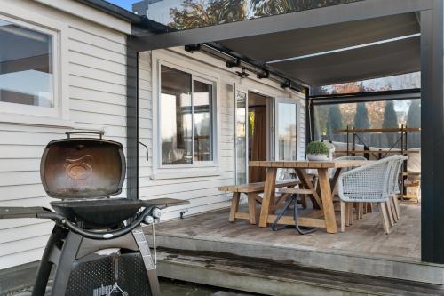 a bike parked on the porch of a tiny house at City Calm Retreat and A Peaceful Family Haven in Christchurch