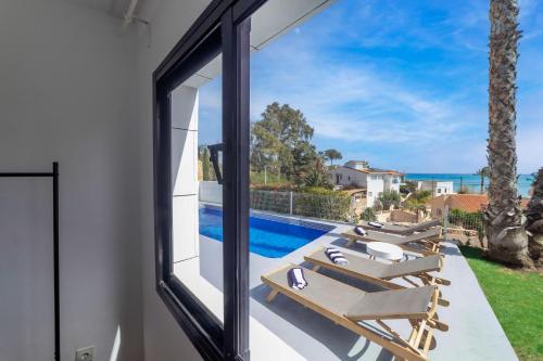 a view of the pool from the balcony of a house at Chalet with sea view in Alicante in El Campello