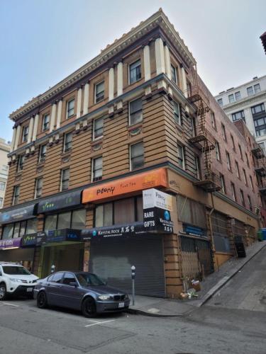 a building with a car parked in front of it at Grant N Pine in San Francisco