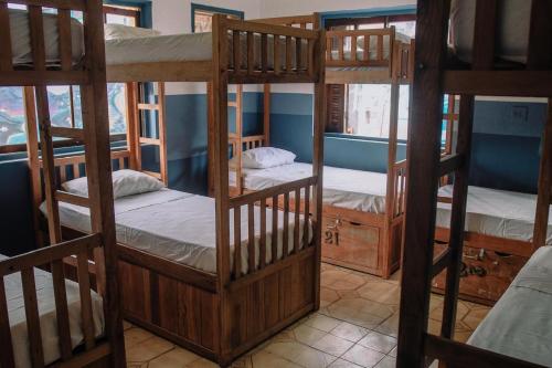 Postel nebo postele na pokoji v ubytování santo hostel parati