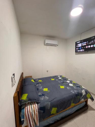 a bedroom with a bed in a room at Villa Manglar in Coveñas