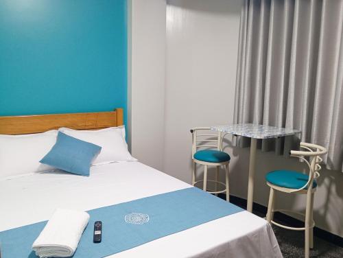 Postel nebo postele na pokoji v ubytování Hospedaje Kava