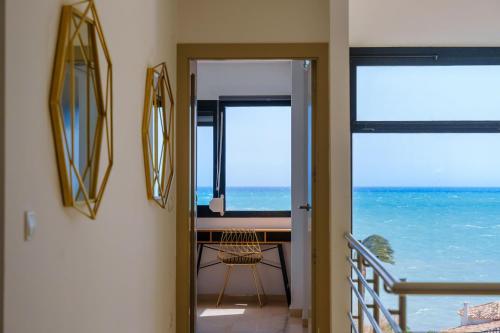 a room with a balcony with a view of the ocean at Chalet with sea view in Alicante in El Campello
