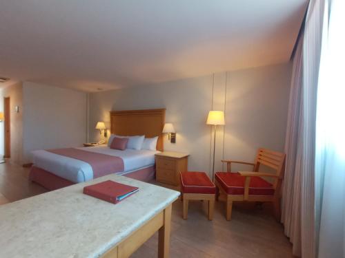 Postel nebo postele na pokoji v ubytování Hotel Palacio Azteca