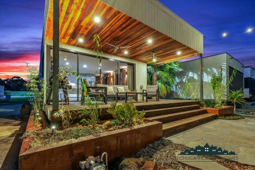 a house with a bench on the front of it at 58 Highview in Moama