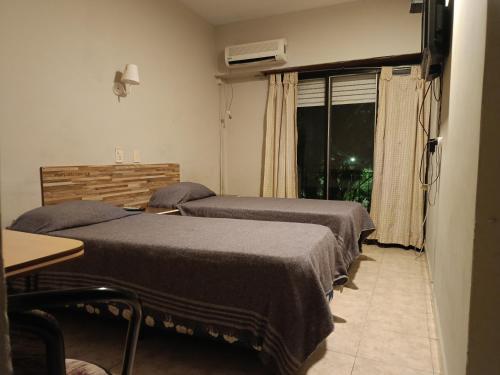 Ένα ή περισσότερα κρεβάτια σε δωμάτιο στο Hotel Manzanares Plaza