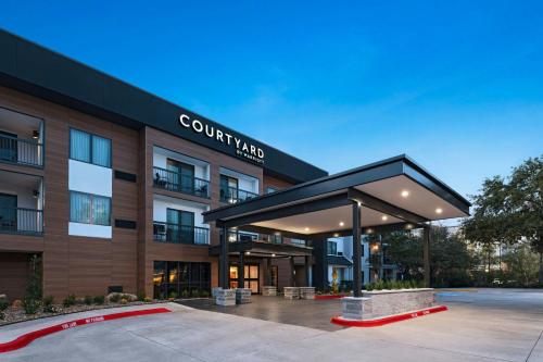 a rendering of a building with a lobby at Courtyard Houston The Woodlands in The Woodlands