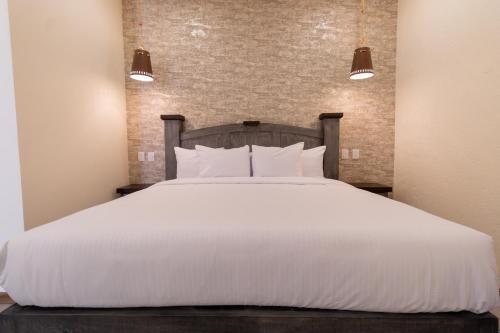 Bendito Capricho Hotelにあるベッド