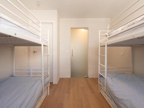 A bed or beds in a room at Penthouse in Belgium with Marina Views