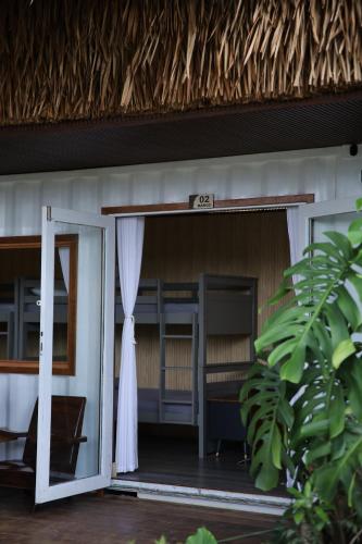 an open door to a room in a house at Upes Garden Homestay Bien Ho in Bien Ho