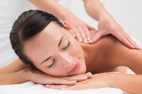 a woman receiving aorativeorative massage in a spa at Ilikai Hotel & Luxury Suites in Honolulu