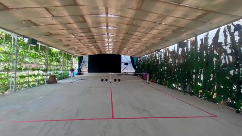 a tunnel with a person standing in the middle at Upes Garden Homestay Bien Ho in Bien Ho