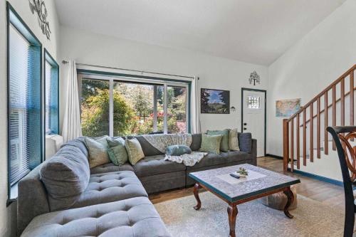 a living room with a couch and a table at Delightful family-friendly home in the heart of WA in Olympia