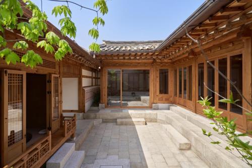 an external view of a house with a courtyard at Nostalgia Hanok Hotel in Seoul