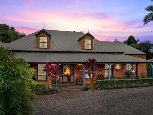a house with a tin roof on a street at Montville Boutique BnB in Montville