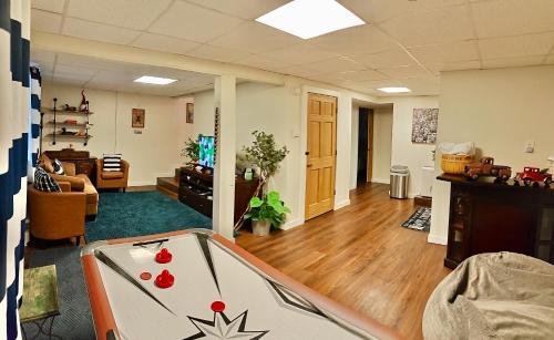 an office with a pool table in the middle of a room at Poconos Getaway with Hot Tub-Close to Attractions, Perfect for Family &Friends! in Blakeslee