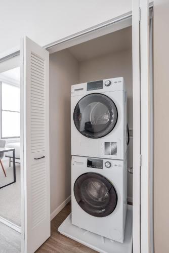 a laundry room with a washer and dryer at CozySuites Sky Central #4 in Cincinnati