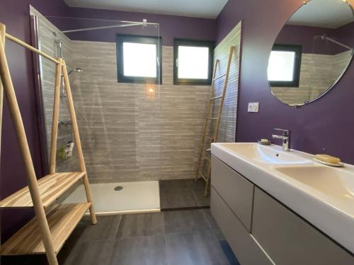 a bathroom with a sink and a shower with purple walls at Grande maison au centre de Perros-Guirec avec jardin, terrasse et WIFI - FR-1-368-460 in Perros-Guirec