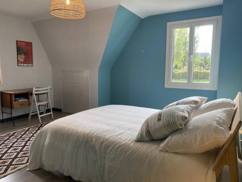 a bedroom with blue walls and a bed with pillows at Grande maison au centre de Perros-Guirec avec jardin, terrasse et WIFI - FR-1-368-460 in Perros-Guirec