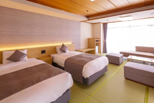 Postel nebo postele na pokoji v ubytování Ooedo Onsen Monogatari Premium Yamashitaya
